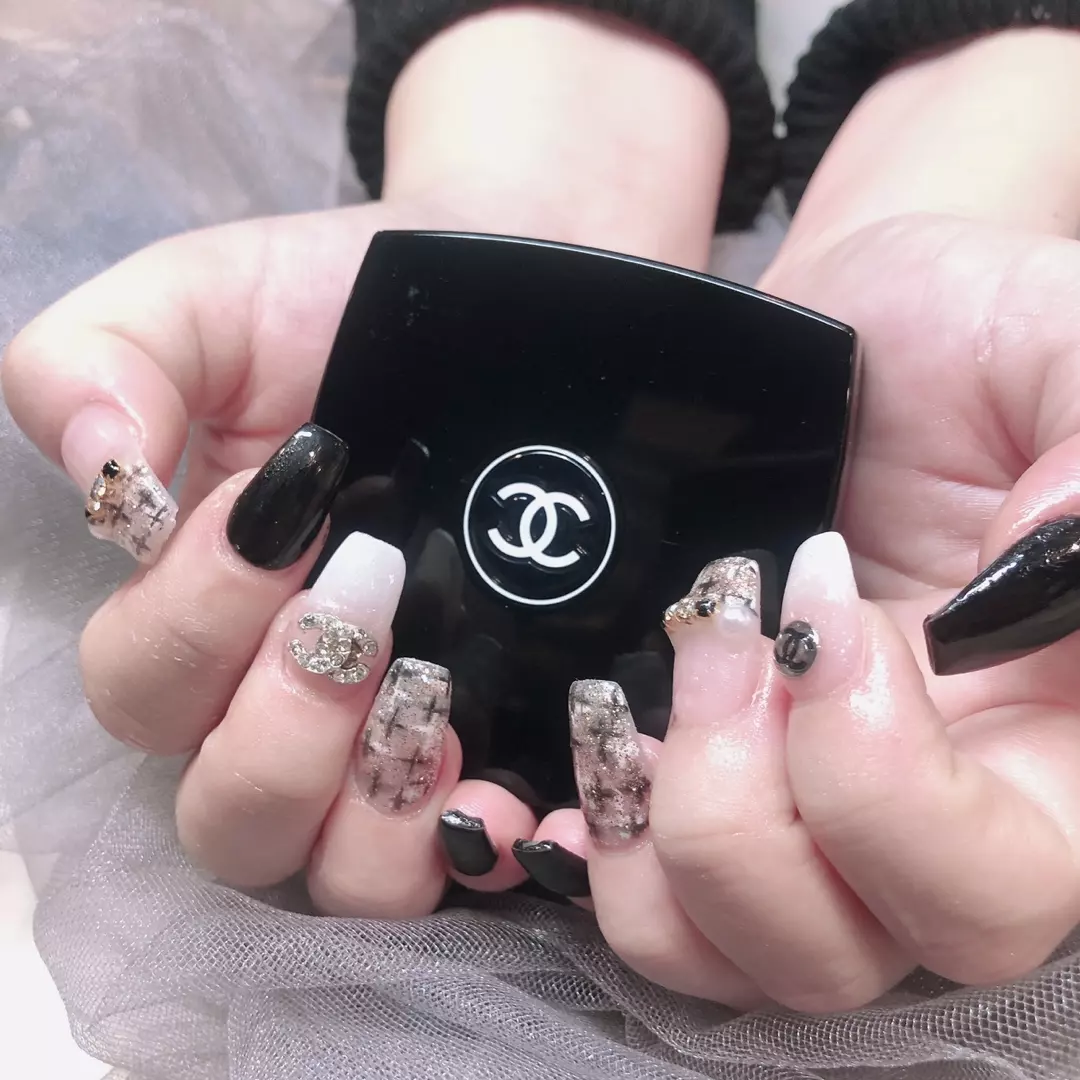 Pink, black and patterned manicure by Bella Beauty