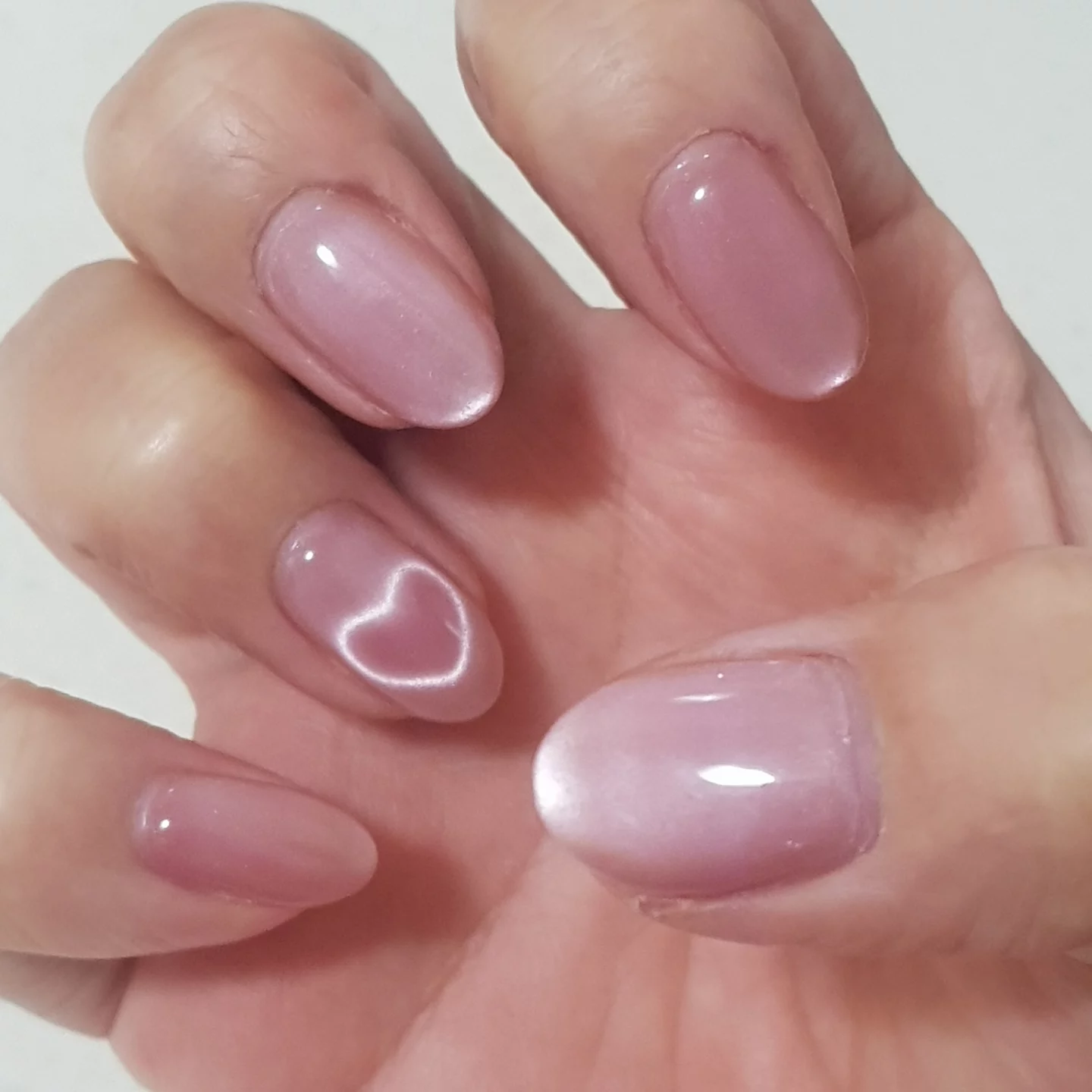 Glossy blush manicure with heart detail by Bella Beauty
